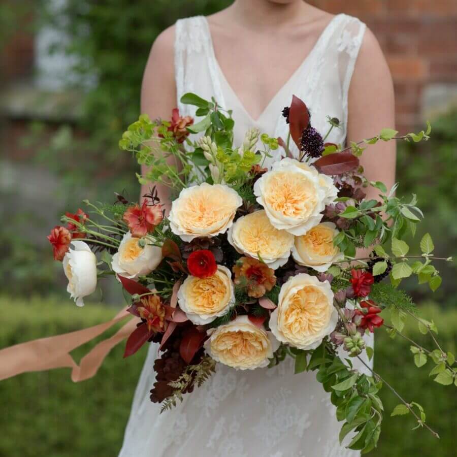 Bridal bouquet featuring Effie roses with apricot tones