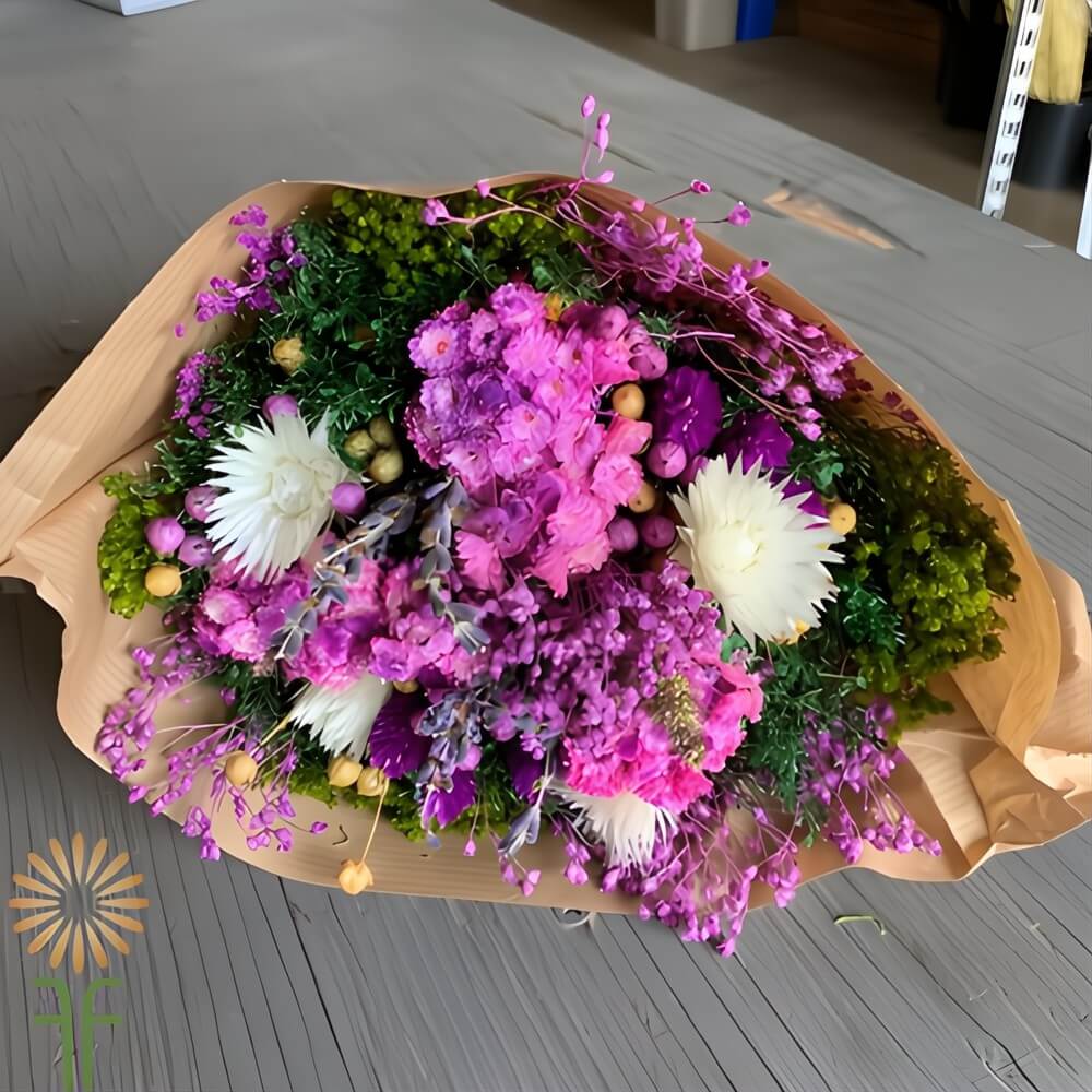 Analogous DIY flower bouquet in shades of violet, magenta, and soft pink, showing color harmony with a dried floral mix.
