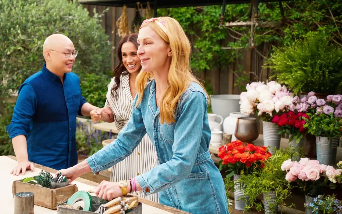 Meghan Markle with friends arranging flowers